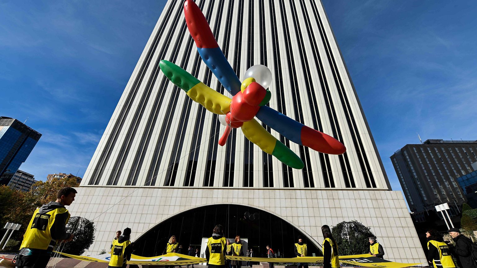Amnesty International activists hold a protest to call on Google to cancel 