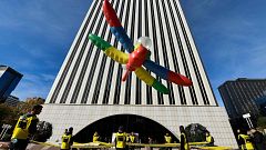 Amnesty International activists hold a protest to call on Google to cancel 