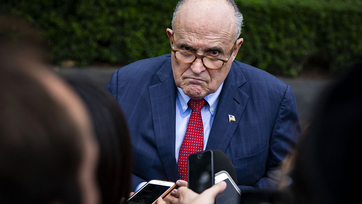 Rudy Giuliani speaks with reporters at the White House