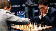 Fabiano Caruana, right, plays against Magnus Carlsen in the 2018 World Ches