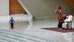 A child on stage during a general audience led by Pope Francis at the Vatic