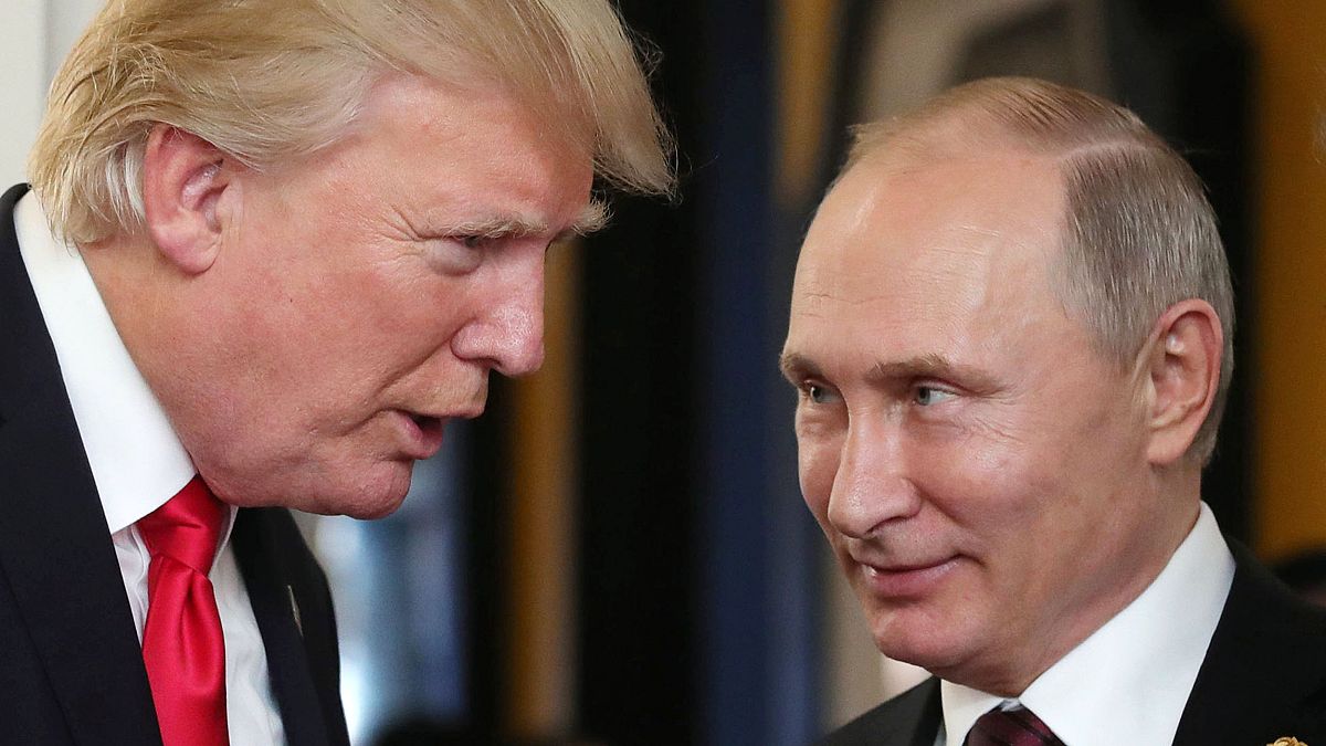 Image: President Donald Trump chats with Russia's President Vladimir Putin 