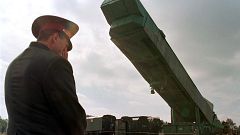 Image: A SS-24 nuclear missile booster is extracted from its bunker in Ukra