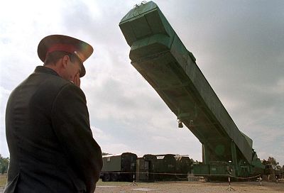 An Ukrainian officer watches a SS-24 nuclear missile booster being extracted from its bunker at a military base in southern Ukrainian town of Pervomaisk in 1998.