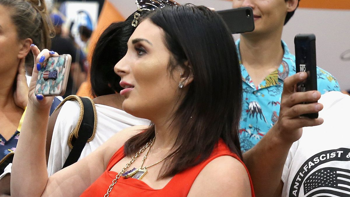 Far-right activist Laura Loomer handcuffs herself to Twitter's New York headquarters