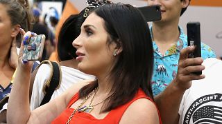 Far-right activist Laura Loomer handcuffs herself to Twitter's New York headquarters