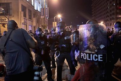 Police move in to apprehend a Reuters news photographer during a protest of the acquittal of former St. Louis police officer Jason Stockley in St. Louis, Missouri, on Sept. 17, 2017.