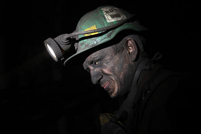 A coal miner works in a shaft around 1100 yards below the surface at the KWK Pniowek coal mine in Pawlowice, Poland, on Friday. Around  3,900 miners descend below ground there to churn out 13,500 tons of high-grade coal each day that will be destined for coking at steel mills across Europe. The COP24 climate conference is being held in nearby Katowice, Poland.