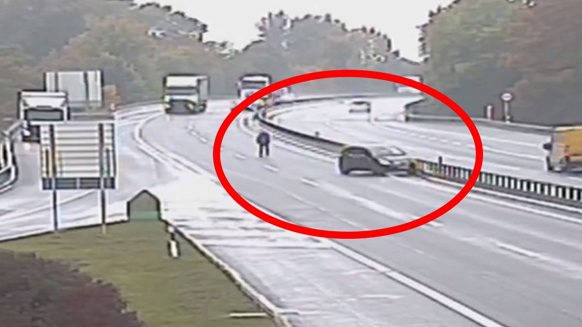 Video: Man chases runaway car across busy motorway