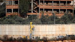 Image: Israeli soldiers standing by machinery near the border wall with Leb