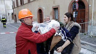 Rescuers help residents affected by overnight quake in central Italy