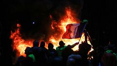 Image: Protestors fly a French flag during a protest of Yellow vests (Gilet