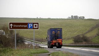 Image: Traffic moving along the a road bear Stonehenge.