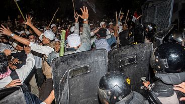 Indonesian police fire tear gas at Muslim protesters