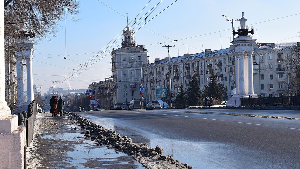 Image: Residents walk along Prospect Soborniy, Zaporizhzhia's main street, 