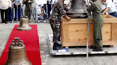 Image: Philippine military personnel unload the three church bells
