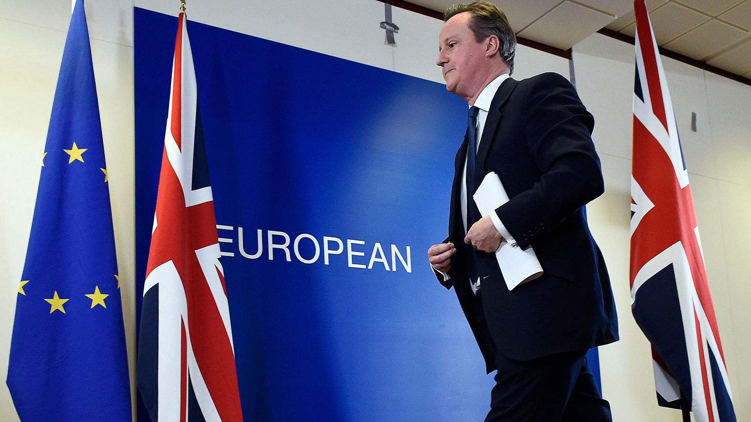 Image: British Prime Minister David Cameron leaves after delivering a press