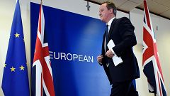 Image: British Prime Minister David Cameron leaves after delivering a press