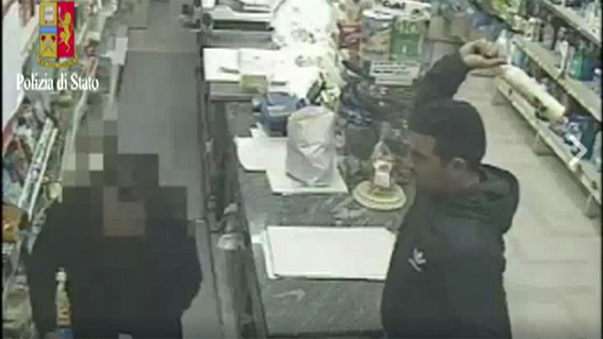 Watch: Robber smashes shopkeeper with bottle in raid in Italy