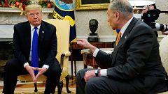 Image: President Donald Trump listens to Senator Chuck Schumer at the White