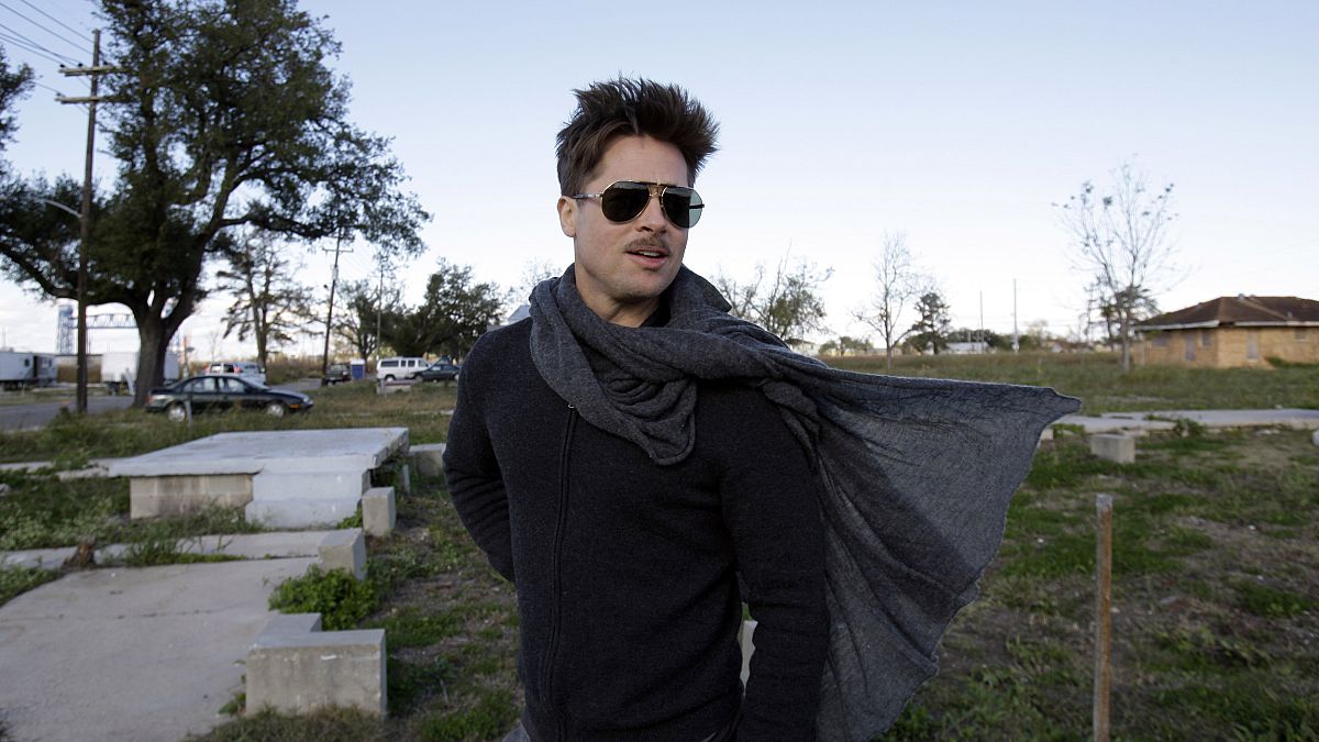 Image: Brad Pitt walks in the Lower 9th Ward where homes are being built fo