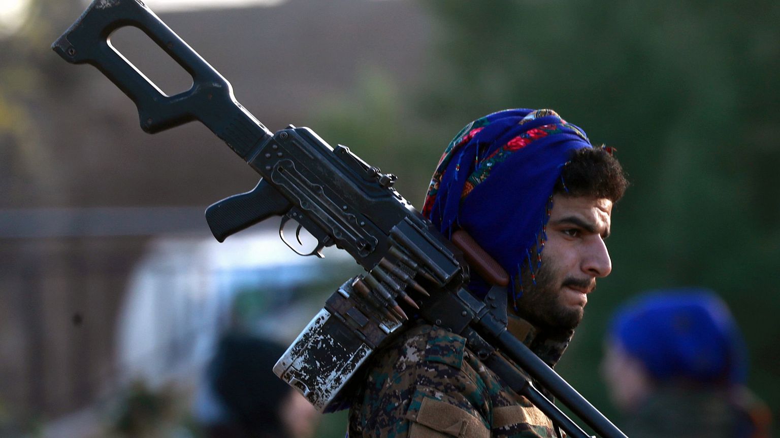 Image: A fighter from the Syrian Democratic Forces (SDF) attends the funera