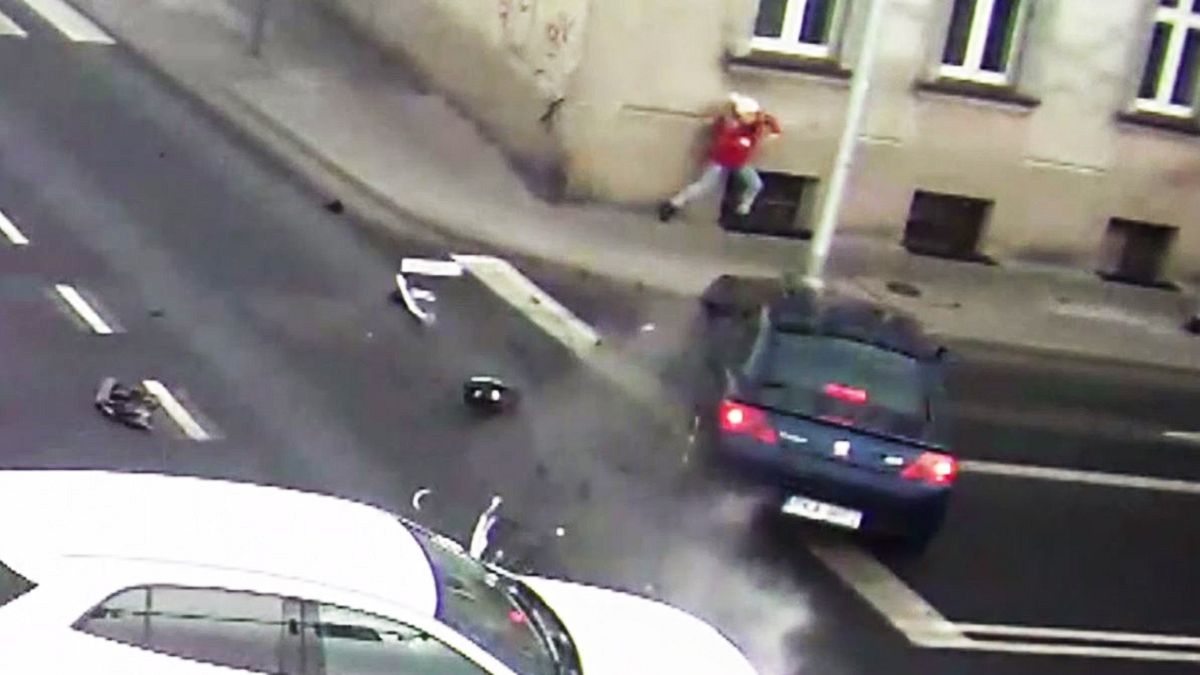 Lamp post protects pedestrian from being hit by speeding car
