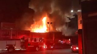 Nine dead, dozens missing after fire breaks out at California warehouse party