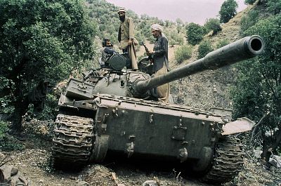 Mujahedeen sit on a captured Soviet tank in Afghanistan in 1987.
