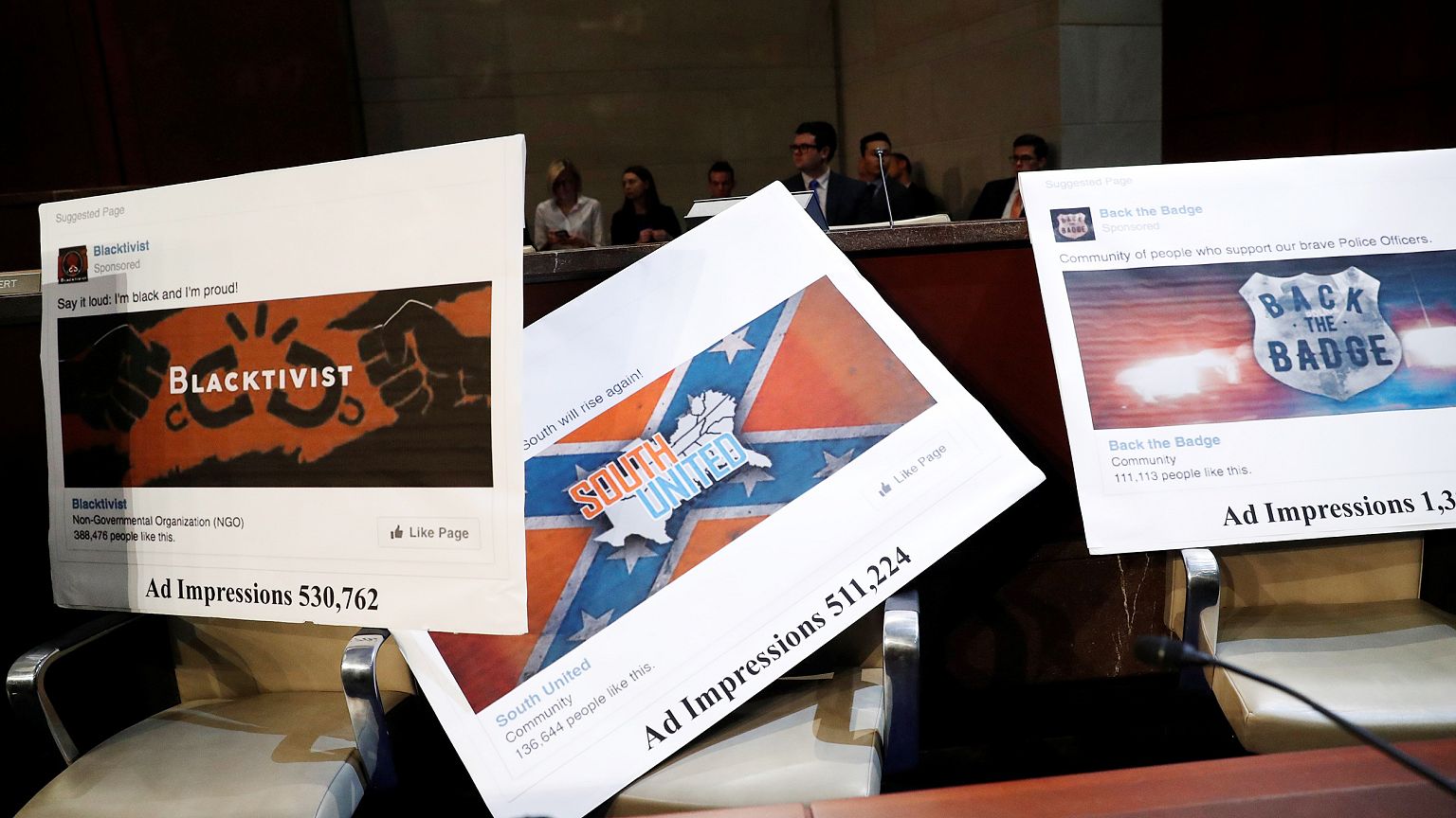 Image: Examples of Facebook pages are seen, as executives appear before the