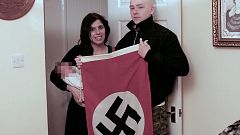 Image: Claudia Patatas and Adam Thomas pose with their son, whose middle na