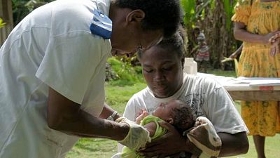 Joy Nowai, the world\'s first child to be given a vaccine delivered commercially by drone in Vanuatu.
