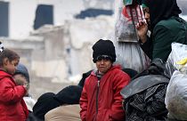 Syria Aleppo: thousands of trapped civilians wait as evacuation halts