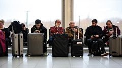 Image: Passengers wait in the South Terminal building at London's Gatwick A