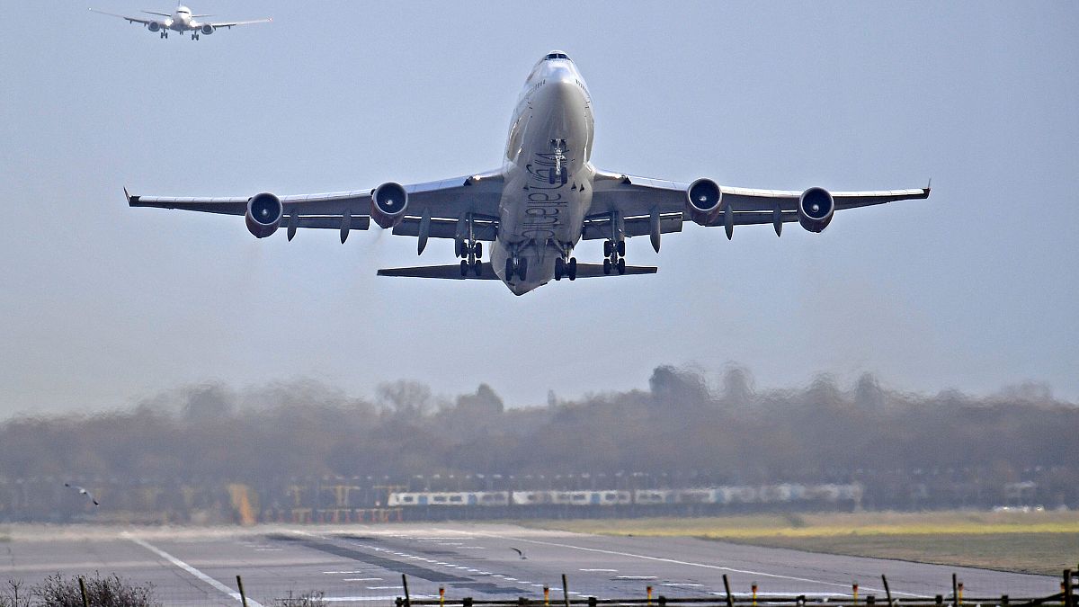 Image: An airplane takes off at Gatwick Airport, after the airport reopened