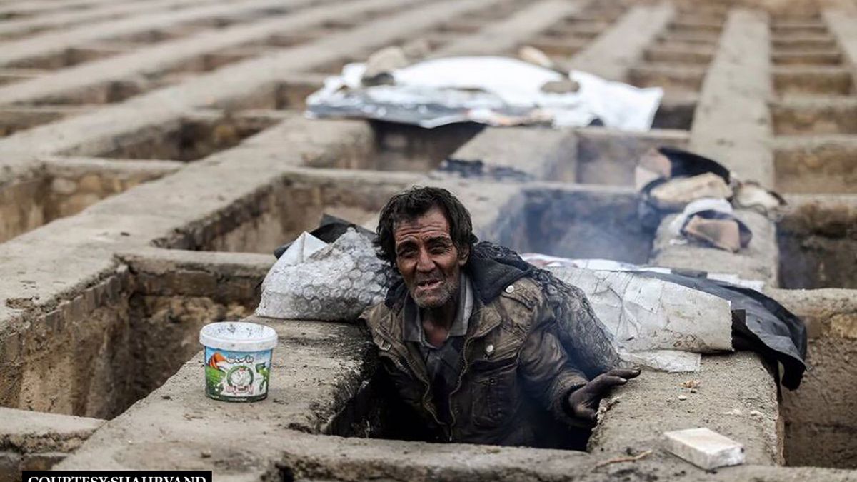In pictures: homeless Iranians find shelter from cold in empty graves