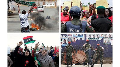 2016 Review: [12 Top Photos] Protests across Africa – flowers, police, flags etc.