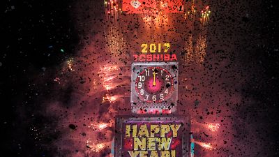 Fireworks and confetti mark the New Year at Times Square