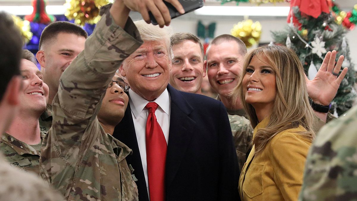 Image: President Donald Trump and First Lady Melania Trump greet military p