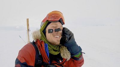 In this photo provided by Colin O\'Brady, of Portland., Ore., he speaks on a phone in Antarctica on Dec. 26, 2018.
