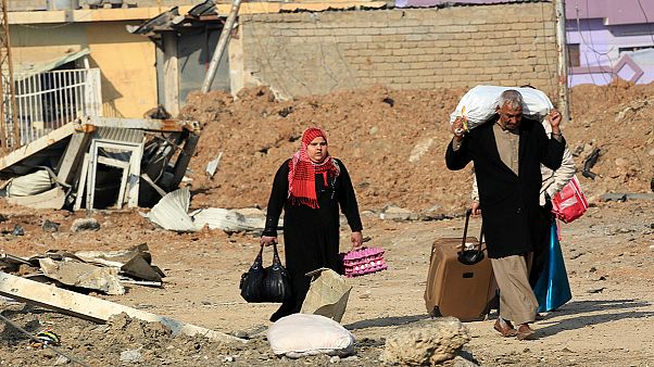 Mossoul : leur quartier repris, ils fuient par craintes de représailles Mossoul : leur quartier repris, ils fuient par craintes de représailles
