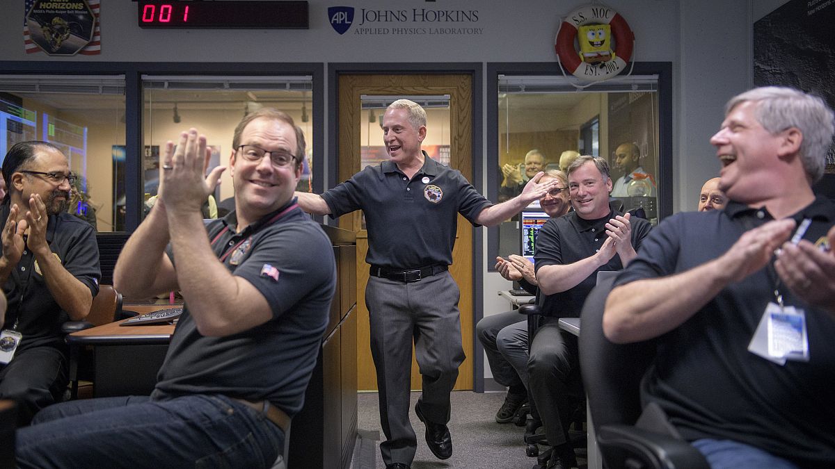 Image: New Horizons principal investigator Alan Stern celebrates with team 