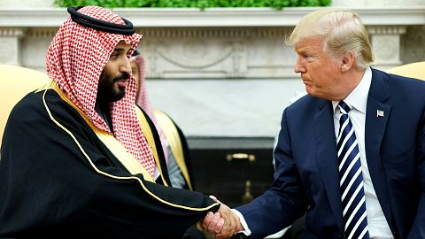 Image: President Donald Trump shakes hands with Saudi Arabia's Crown Prince