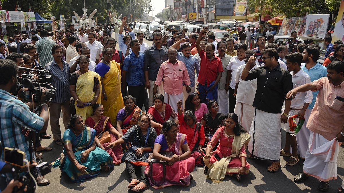Image: Demonstrators block traffic while protesting reports that two women 