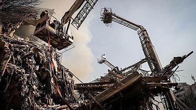 Tehran building collapse: search for missing firefighters