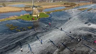 Skating on frozen water in The Netherlands