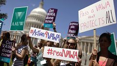 Image: Demonstrators hold a rally in support of the Violence Against Women 