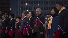 Taiwan president urges China to use peaceful means to solve differences in 