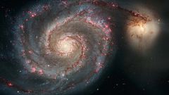 Looming galactic collision will rip open the black hole at the Milky Way's center
