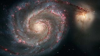 Looming galactic collision will rip open the black hole at the Milky Way's center